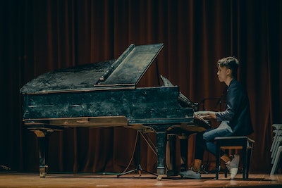 Man playing the piano on stage